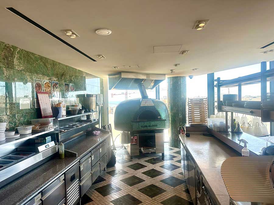Custom teal mosaic Valoriani wood-burning pizza oven in the Cabana Club pizzeria, ME Malta