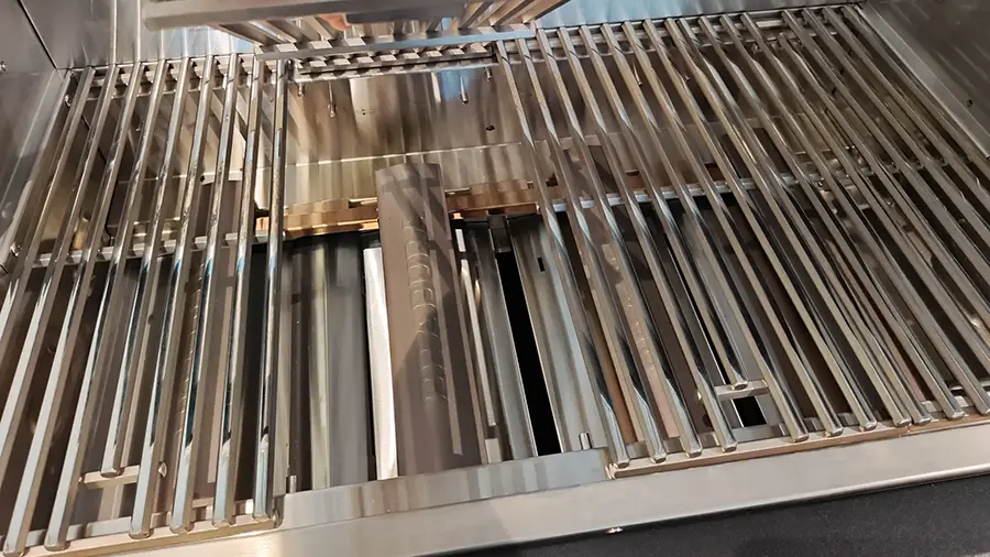 Close-up of Brabura Grills stainless steel cooking grates showing burner configuration and heavy-duty construction