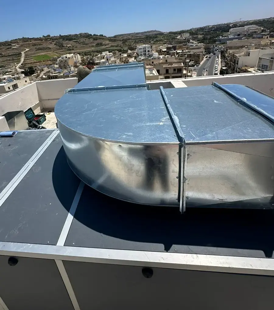 Custom fabricated ductwork and filtration housing on the rooftop at Casa Giuseppe Care Home, Gozo, overlooking Victoria