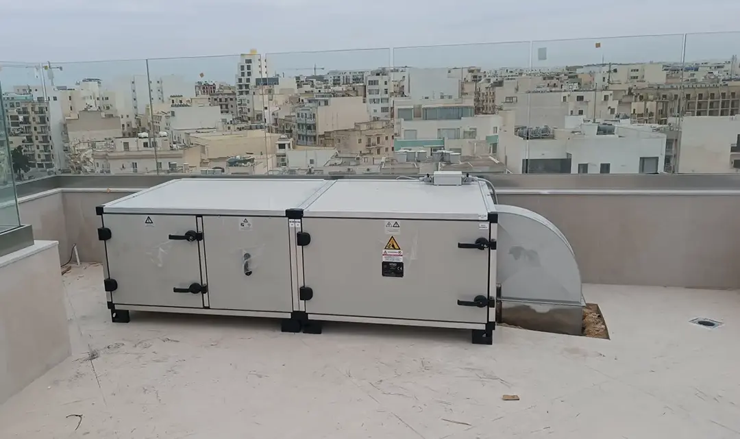 Close-up of a stainless steel commercial extraction canopy with baffle filters still in protective wrapping, ready for commissioning
