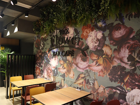 The Flower Bar Caf&eacute; interior at the Duke Shopping Mall, Victoria, Gozo, showing floral mural and seating area.