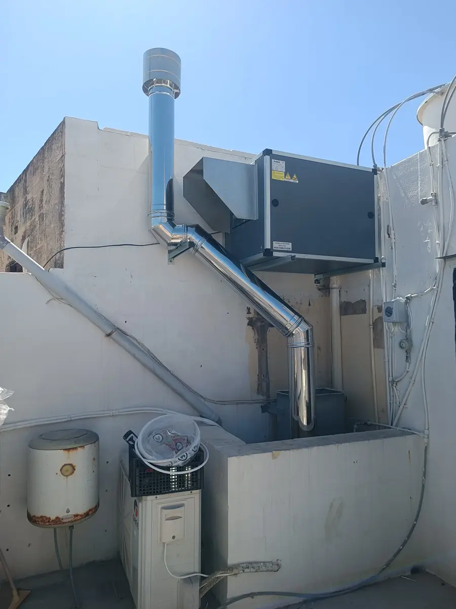 The flue from the Valoriani oven exiting through the wall behind the dome and running towards the rooftop at Joe's Street Pizza, Nadur